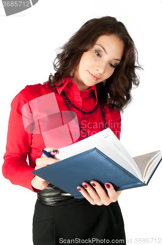 Image of Pretty businesswoman standing with organizer diary