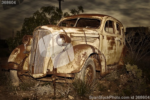 Image of old rusted car