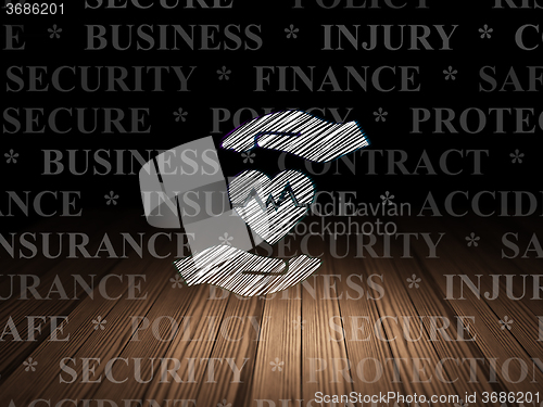 Image of Insurance concept: Heart And Palm in grunge dark room