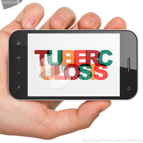 Image of Medicine concept: Hand Holding Smartphone with Tuberculosis on  display