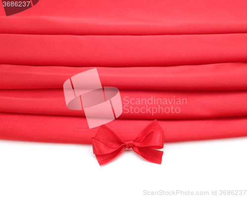 Image of red silk fabric with bow