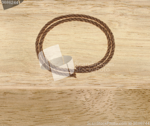 Image of rope frame on wood background