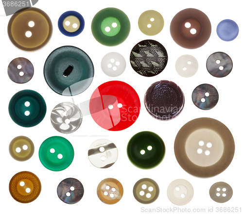 Image of collection of various sewing button on white background