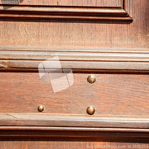 Image of door in italy old ancian wood and trasditional  texture nail