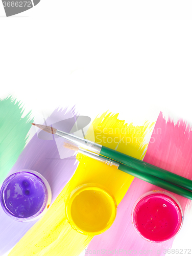 Image of Color paints and brushes isolation on white background