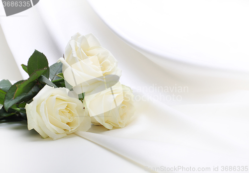 Image of roses bouquet on silk