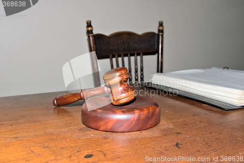 Image of judges gavel on old desk