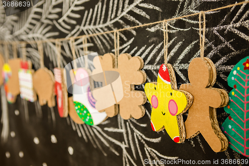 Image of Cardboard toys for the Christmas tree or garland. Creative decorations. Selective Focus