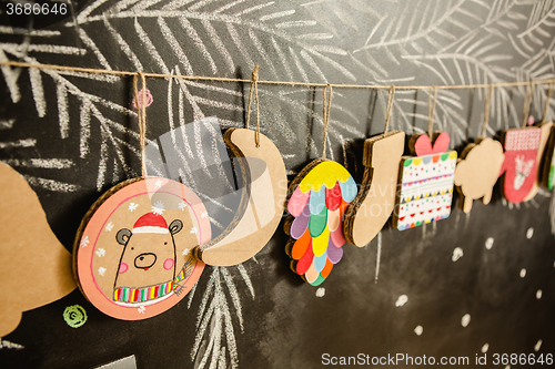 Image of Cardboard toys for the Christmas tree or garland. Creative decorations. Selective Focus