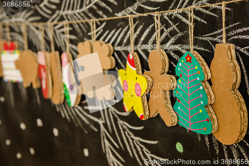 Image of Cardboard toys for the Christmas tree or garland. Creative decorations. Selective Focus