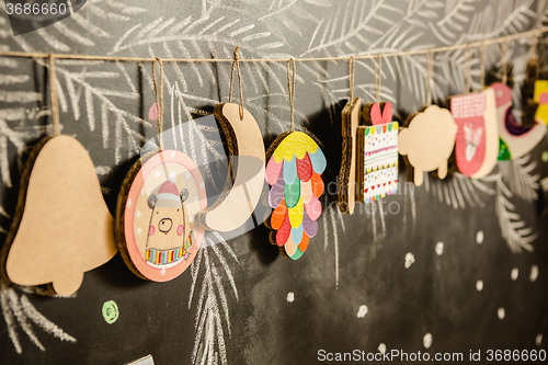 Image of Cardboard toys for the Christmas tree or garland. Creative decorations. Selective Focus