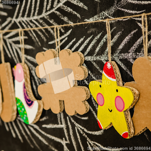 Image of Cardboard toys for the Christmas tree or garland. Creative decorations. Selective Focus