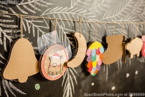 Image of Cardboard toys for the Christmas tree or garland. Creative decorations. Selective Focus