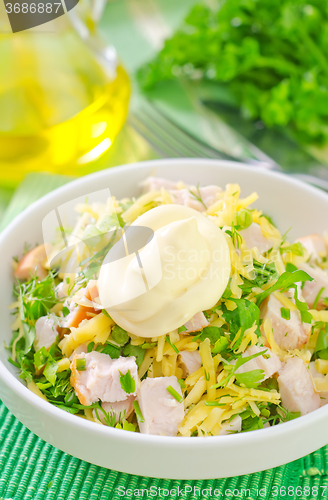 Image of salad with chicken and cheese