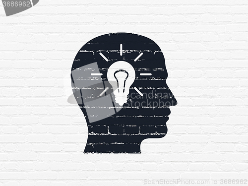 Image of Data concept: Head With Light Bulb on wall background