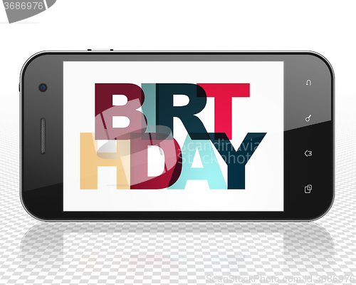Image of Holiday concept: Smartphone with Birthday on  display