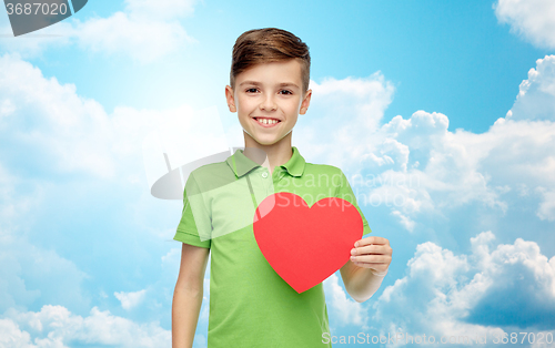 Image of happy boy holding red heart shape