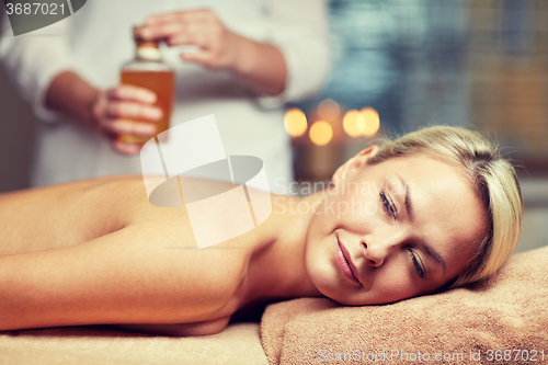 Image of close up of woman lying on massage table in spa