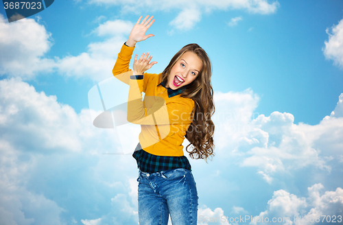 Image of happy young woman or teen girl applauding