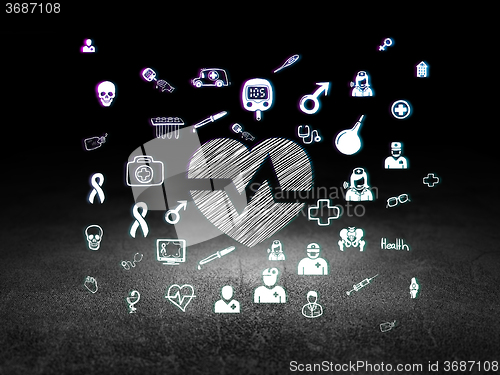 Image of Medicine concept: Heart in grunge dark room