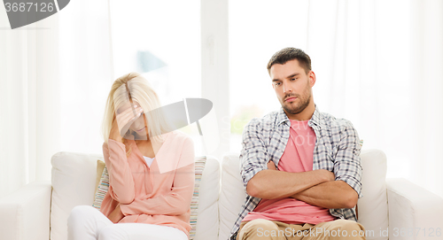 Image of unhappy couple having argument at home