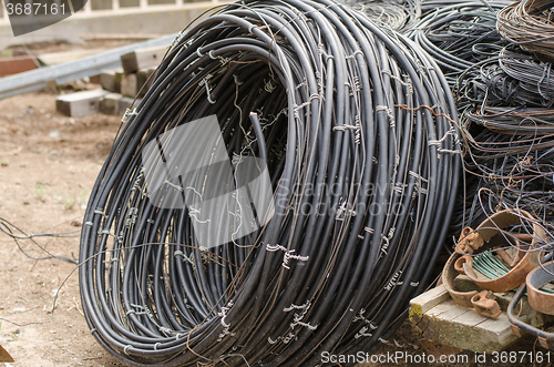 Image of Pile of old wires lying on the ground