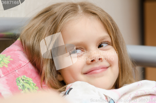 Image of Five-year girl cute smile looking to the left