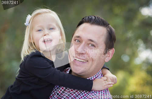 Image of Adorable Little Girl Having Fun With Daddy Outdoors