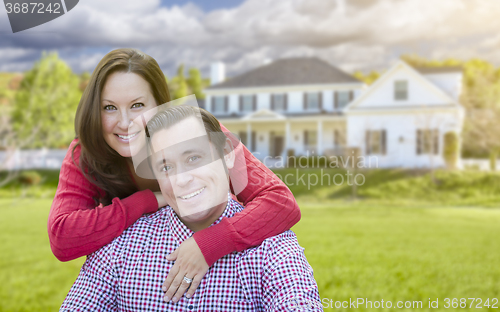 Image of Happy Couple Outdoors In Front of Beautiful House