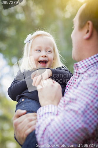 Image of Adorable Little Girl Having Fun With Daddy Outdoors