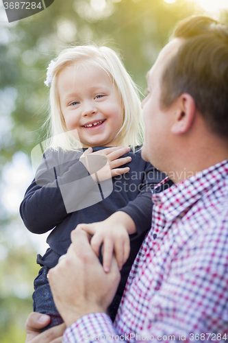 Image of Adorable Little Girl Having Fun With Daddy Outdoors