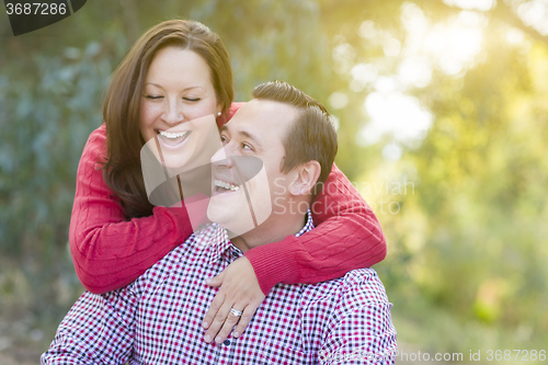 Image of Attractive Caucasian Couple Laughing Outdoors