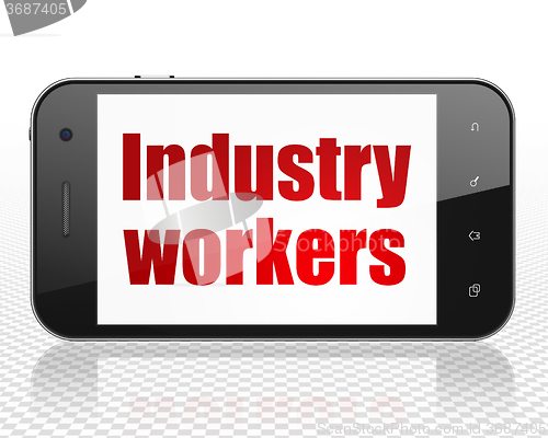 Image of Industry concept: Smartphone with Industry Workers on display