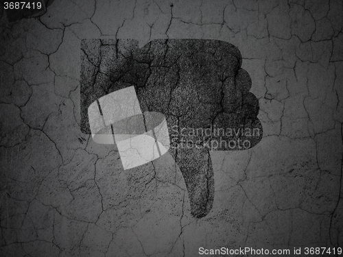 Image of Social network concept: Thumb Down on grunge wall background