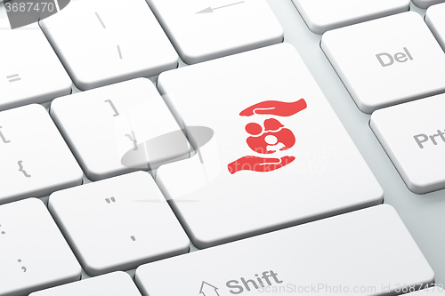 Image of Insurance concept: Family And Palm on computer keyboard background
