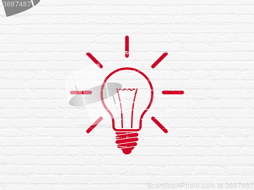 Image of Finance concept: Light Bulb on wall background