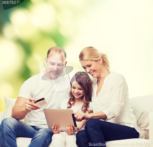 Image of happy family with tablet pc and credit card