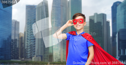 Image of boy in red super hero cape and mask