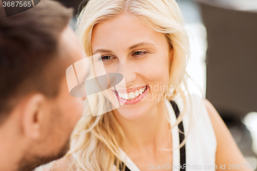 Image of happy couple faces at restaurant