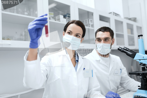 Image of young scientists making test or research in lab