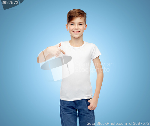 Image of happy boy pointing finger to his white t-shirt