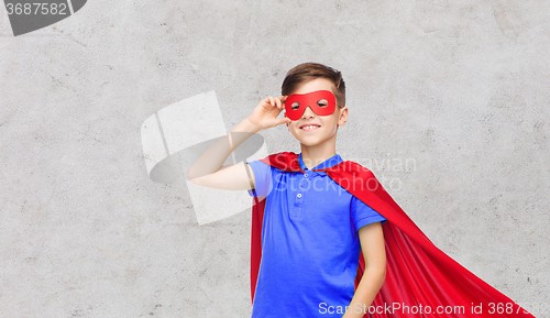 Image of boy in red superhero cape and mask