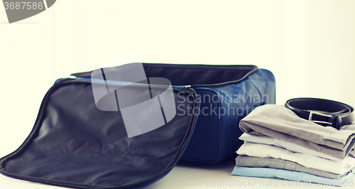 Image of close up of business travel bag and clothes