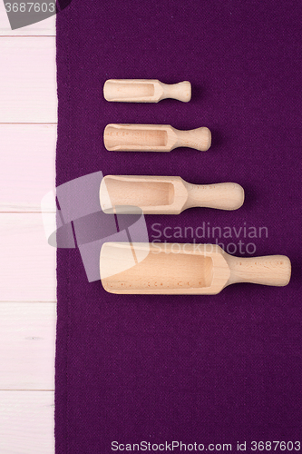 Image of Kitchenware on purple towel