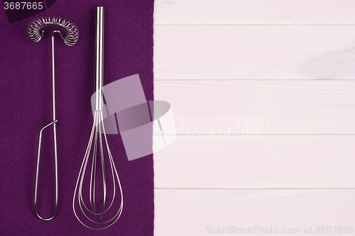 Image of Kitchenware on purple towel