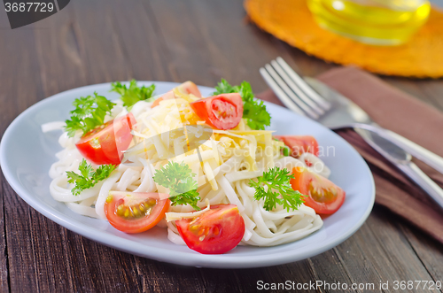 Image of pasta with cheese and tomato