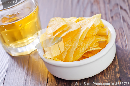 Image of chips from potato with beer