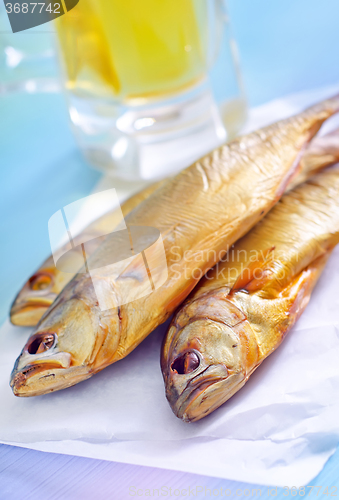 Image of smoked fish with beer