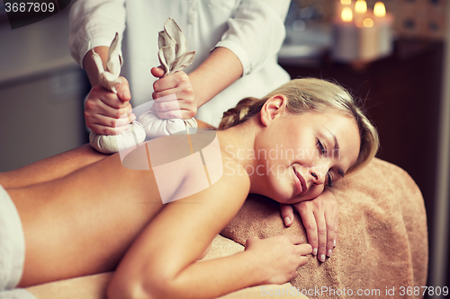 Image of close up of woman lying on massage table in spa