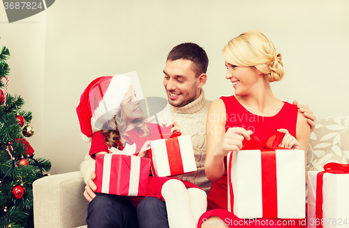 Image of happy family opening gift boxes